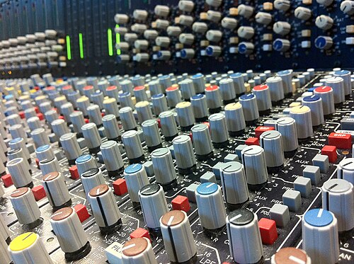 Sound engineer at a mixing desk during soundcheck
