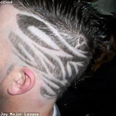 Barber cutting a skin fade with clippers