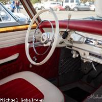 Car interior being vacuumed and detailed
