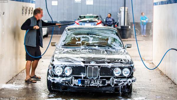 Car being hand-washed with foam