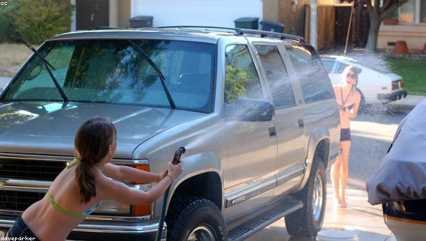 Freshly washed SUV drying in a wash bay