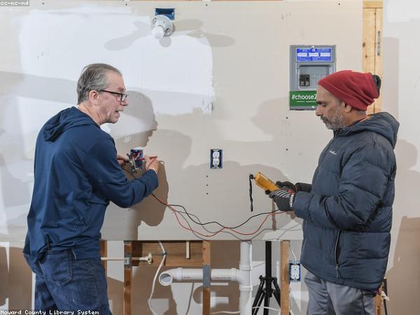 Electrician testing a distribution board