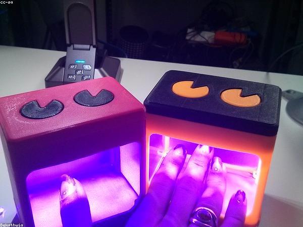 Nail technician applying gel polish at Glow Studio