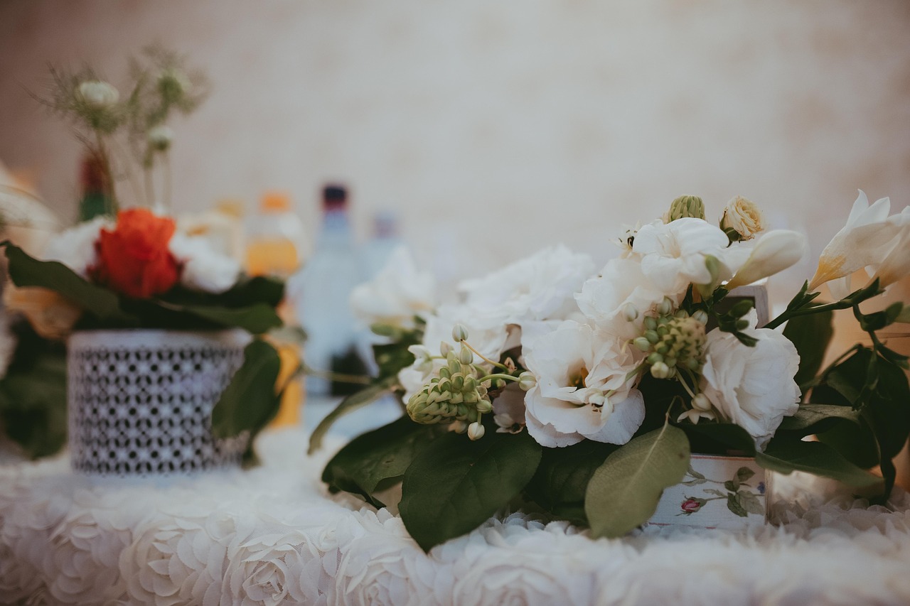 Bride holding a loose garden-style bouquet of blush and white roses
