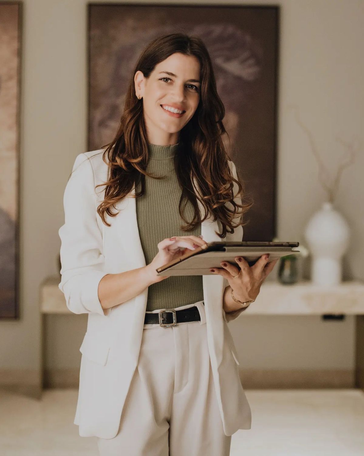 Wedding planner reviewing a run sheet with a couple at a venue walkthrough